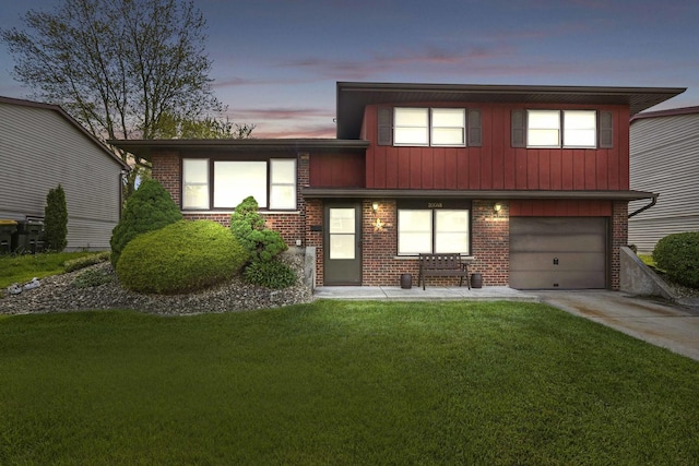 20048 Orchard Ave, Lynwood, IL 60411 - split level home featuring driveway, brick siding, a front yard, and an attached garage