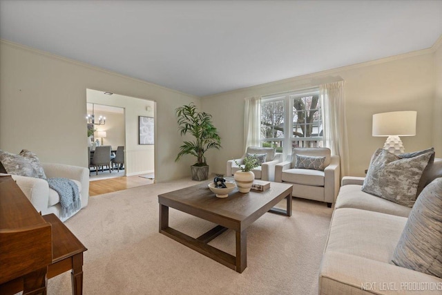 554 Carriage Hill Rd, Naperville, IL 60565 - living area with ornamental molding, a chandelier, and light carpet