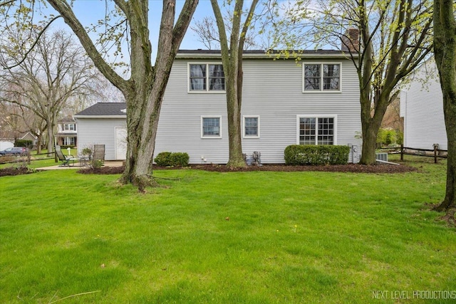 554 Carriage Hill Rd, Naperville, IL 60565 - rear view of property featuring a chimney and a yard