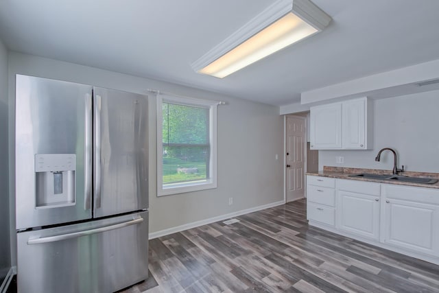 506 Sunrise Dr, Mchenry, IL 60051 - kitchen with stainless steel fridge, a sink, white cabinets, wood finished floors, and baseboards