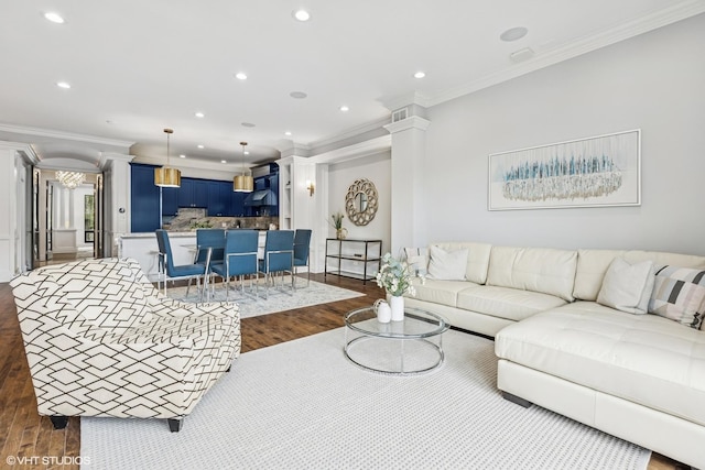 1717 W Huron St, Chicago, IL 60622 - living room with dark wood-style floors, recessed lighting, crown molding, and ornate columns