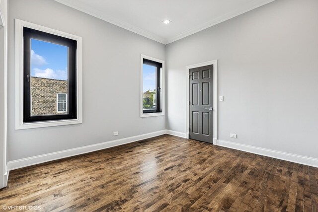 1717 W Huron St, Chicago, IL 60622 - spare room with dark wood-type flooring, baseboards, crown molding, and recessed lighting