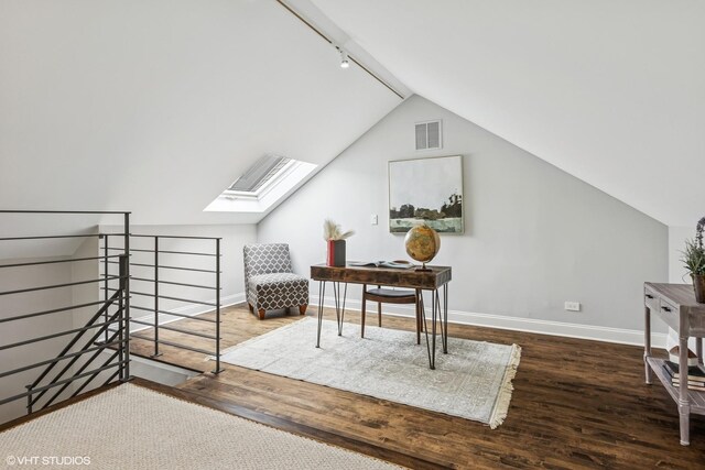 1717 W Huron St, Chicago, IL 60622 - office with wood finished floors, baseboards, a skylight, rail lighting, and lofted ceiling