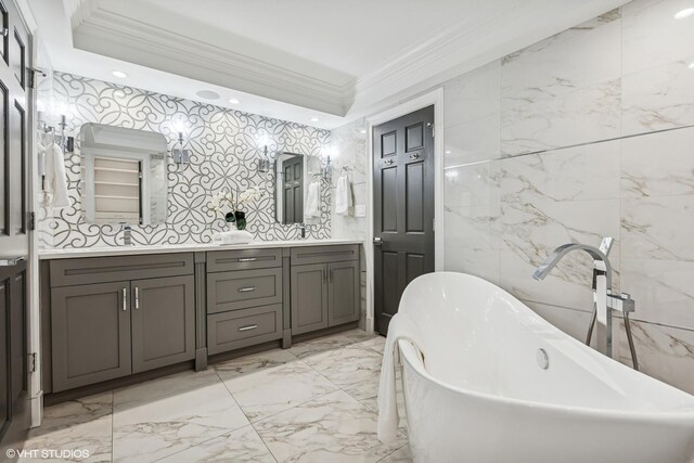 1717 W Huron St, Chicago, IL 60622 - bathroom featuring double vanity, ornamental molding, a soaking tub, and marble tiled floors