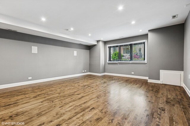 1717 W Huron St, Chicago, IL 60622 - empty room featuring wood finished floors, baseboards, and recessed lighting