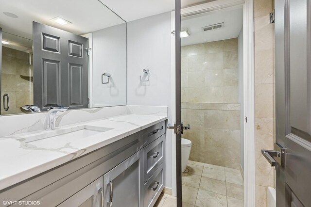 1717 W Huron St, Chicago, IL 60622 - bathroom with toilet, vanity, and tile patterned flooring