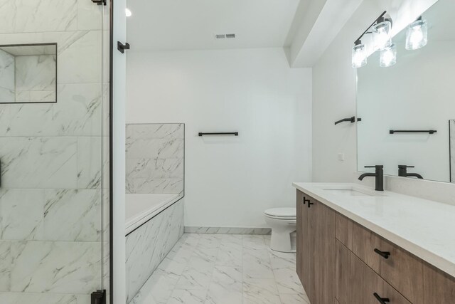2714 W Cortez St Unit 1, Chicago, IL 60622 - bathroom featuring marble finish floors, vanity, a garden tub, toilet, and baseboards