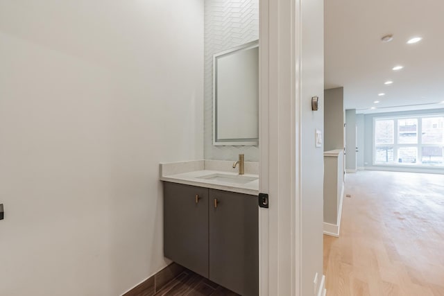 2714 W Cortez St Unit 1, Chicago, IL 60622 - bathroom featuring wood finished floors, baseboards, vanity, and recessed lighting