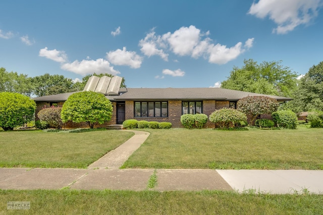 337 George St, Sycamore, IL 60178 - view of front of house with brick siding and a front lawn
