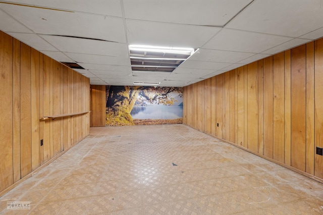 337 George St, Sycamore, IL 60178 - finished below grade area featuring wood walls, a paneled ceiling, and tile patterned floors