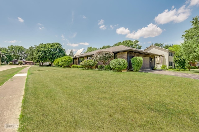 337 George St, Sycamore, IL 60178 - view of front of house with driveway, an attached garage, and a front yard