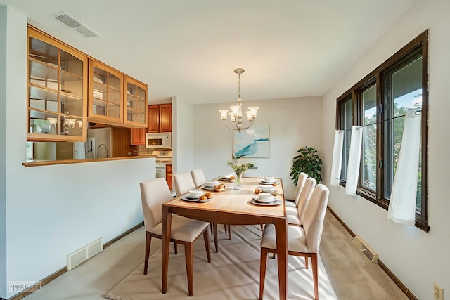 337 George St, Sycamore, IL 60178 - dining room with a chandelier and light carpet