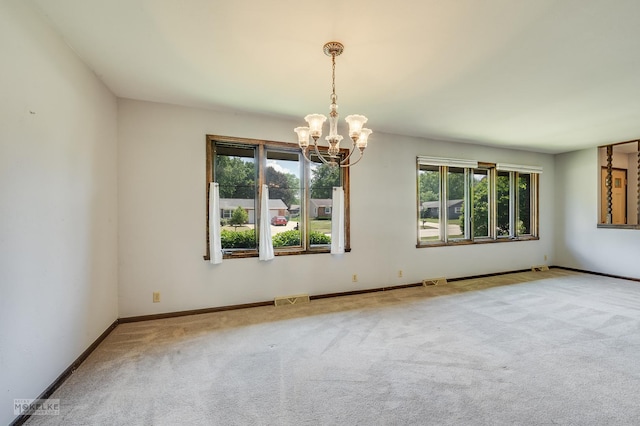 337 George St, Sycamore, IL 60178 - carpeted empty room with a chandelier and baseboards