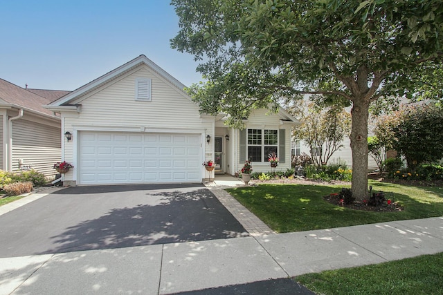 11646 Evergreen Ln, Huntley, IL 60142 - view of front facade with driveway, a front yard, and a garage