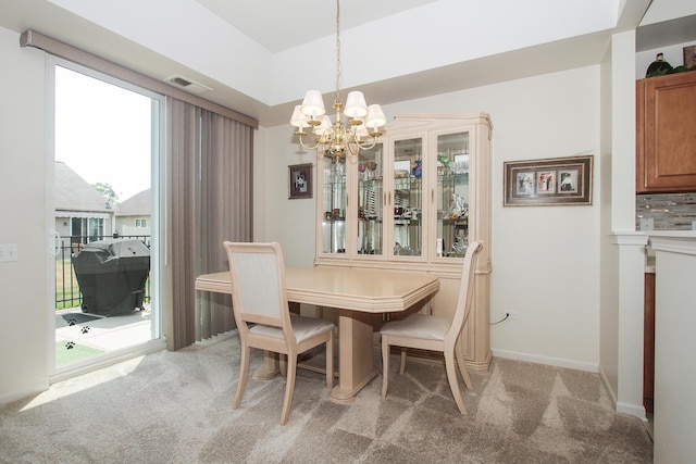 11646 Evergreen Ln, Huntley, IL 60142 - dining room featuring light carpet and a chandelier