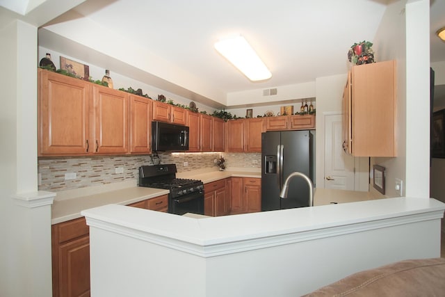 11646 Evergreen Ln, Huntley, IL 60142 - kitchen featuring black appliances, decorative backsplash, light countertops, and a peninsula