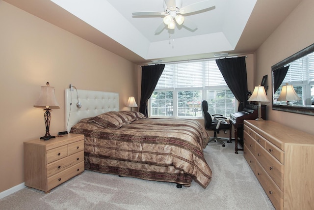 11646 Evergreen Ln, Huntley, IL 60142 - bedroom with light colored carpet, an office area, a raised ceiling, and ceiling fan