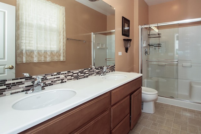 11646 Evergreen Ln, Huntley, IL 60142 - full bathroom featuring a stall shower, double vanity, and backsplash