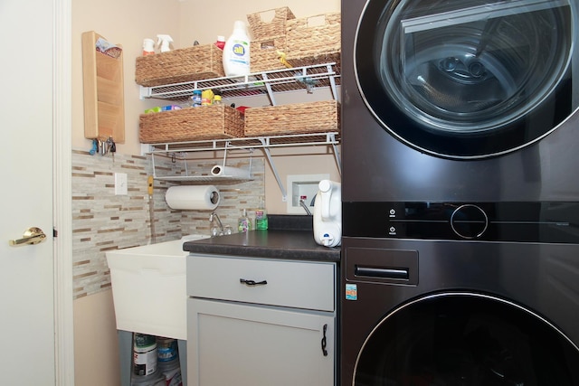 11646 Evergreen Ln, Huntley, IL 60142 - laundry area with stacked washer / drying machine and cabinet space