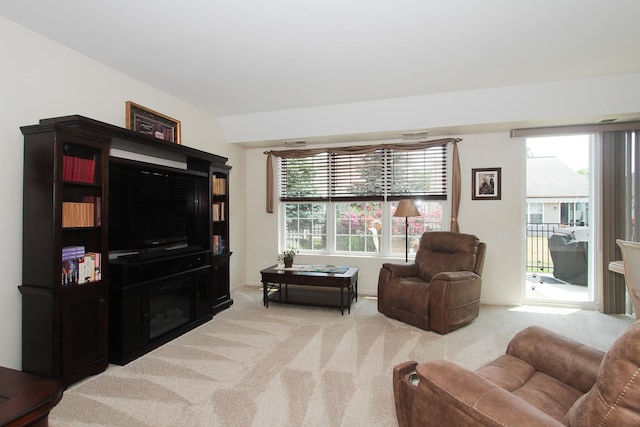 11646 Evergreen Ln, Huntley, IL 60142 - living area featuring light colored carpet, plenty of natural light, and lofted ceiling