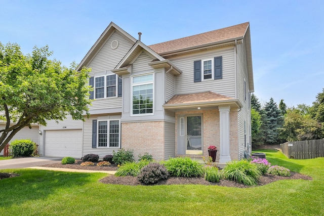 2226 Tremont Ave, Aurora, IL 60502 - view of front of house featuring brick siding, driveway, roof with shingles, and a garage