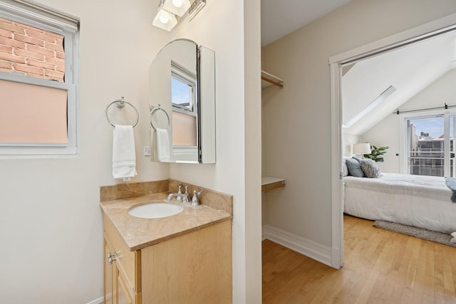 1325 W Wolfram St Unit 3, Chicago, IL 60657 - bathroom featuring healthy amount of natural light, vanity, wood finished floors, and ensuite bath