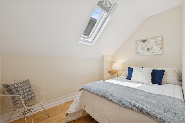 1325 W Wolfram St Unit 3, Chicago, IL 60657 - bedroom with wood finished floors, a skylight, lofted ceiling, and baseboards