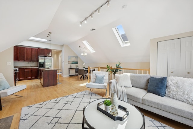 1325 W Wolfram St Unit 3, Chicago, IL 60657 - living room featuring a skylight, light wood-type flooring, and lofted ceiling