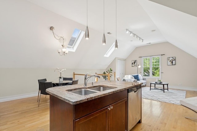 1325 W Wolfram St Unit 3, Chicago, IL 60657 - kitchen with a sink, open floor plan, dishwasher, vaulted ceiling, and light wood finished floors