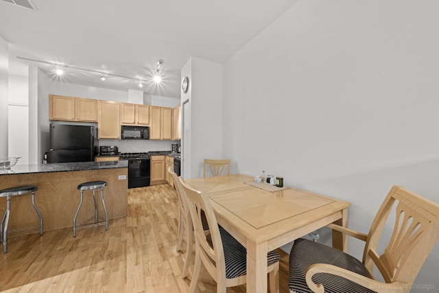 333 N Jefferson St Unit 307, Chicago, IL 60661 - dining area featuring light wood-style flooring