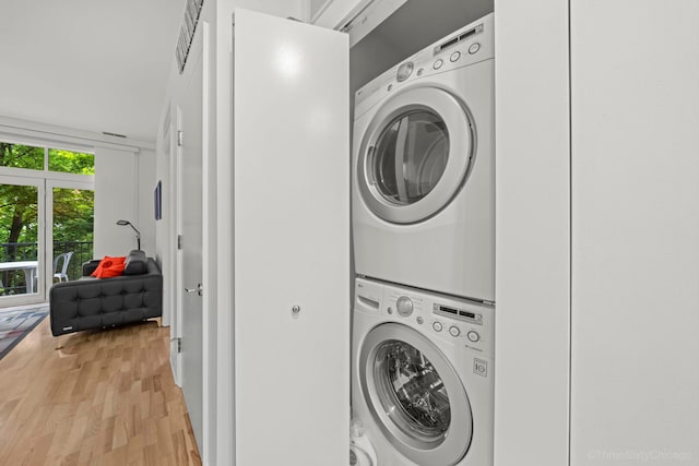 333 N Jefferson St Unit 307, Chicago, IL 60661 - laundry area with stacked washer / drying machine and light wood-type flooring