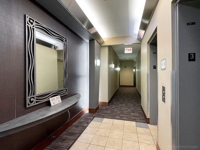 333 N Jefferson St Unit 307, Chicago, IL 60661 - hall with tile patterned floors, carpet floors, and elevator
