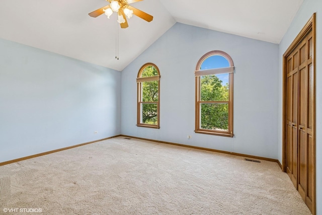 321 Greens View Dr, Algonquin, IL 60102 - unfurnished bedroom featuring light carpet, a closet, baseboards, a ceiling fan, and high vaulted ceiling