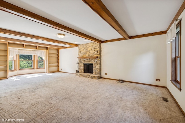 321 Greens View Dr, Algonquin, IL 60102 - unfurnished living room with carpet floors, beam ceiling, a stone fireplace, and baseboards