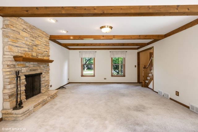 321 Greens View Dr, Algonquin, IL 60102 - unfurnished living room featuring beamed ceiling, light colored carpet, stairway, a stone fireplace, and baseboards