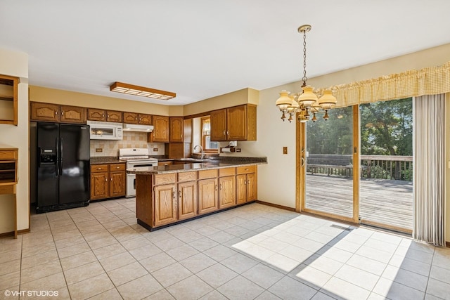 321 Greens View Dr, Algonquin, IL 60102 - kitchen with white appliances, a sink, a peninsula, brown cabinets, and under cabinet range hood