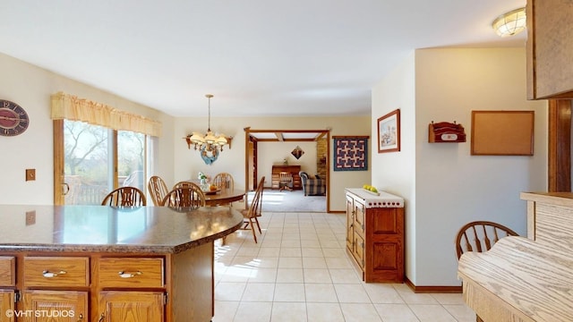 321 Greens View Dr, Algonquin, IL 60102 - kitchen with a chandelier, light tile patterned floors, brown cabinets, and decorative light fixtures
