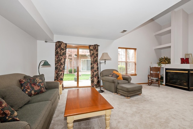 5318 W Dixie Dr Unit 10, Alsip, IL 60803 - living area featuring carpet, a glass covered fireplace, lofted ceiling, and baseboards