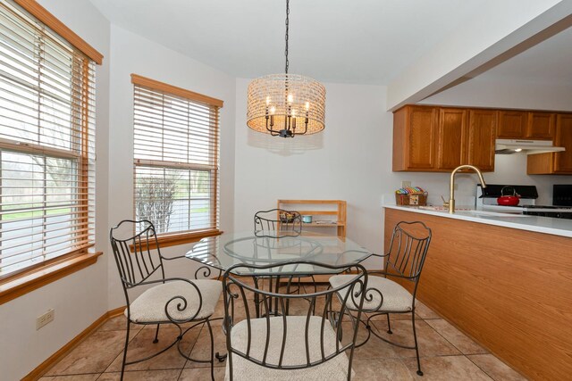 5318 W Dixie Dr Unit 10, Alsip, IL 60803 - dining space with a chandelier, light tile patterned floors, and baseboards