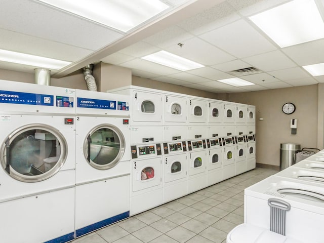 5320 N Sheridan Rd Unit 2209, Chicago, IL 60640 - shared laundry room with washer and dryer, light tile patterned floors, and stacked washer and clothes dryer