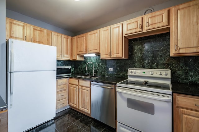 5320 N Sheridan Rd Unit 2209, Chicago, IL 60640 - kitchen with appliances with stainless steel finishes, a sink, light brown cabinetry, dark countertops, and dark tile patterned floors