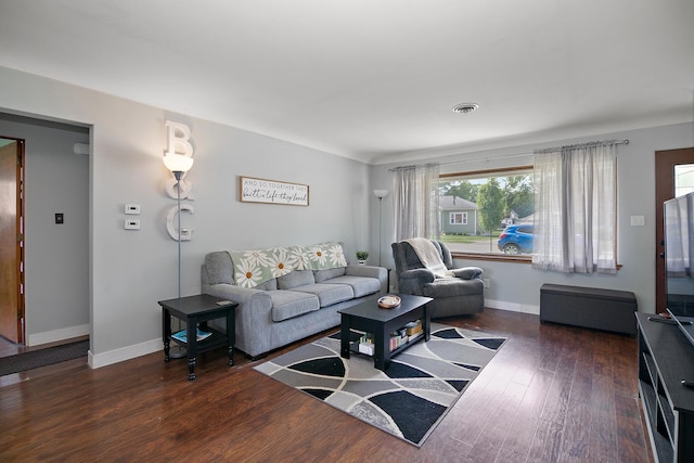 329 W Wood Ave, Peotone, IL 60468 - living room featuring wood finished floors and baseboards