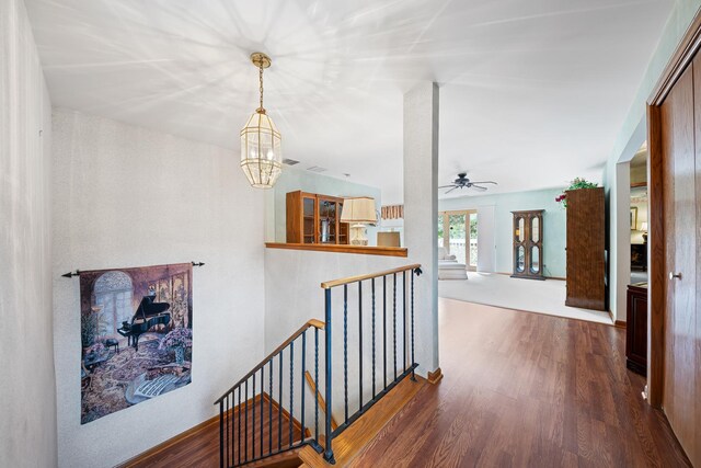 8964 Dublin St Unit 12C, Orland Park, IL 60462 - corridor featuring an upstairs landing, wood finished floors, and a chandelier
