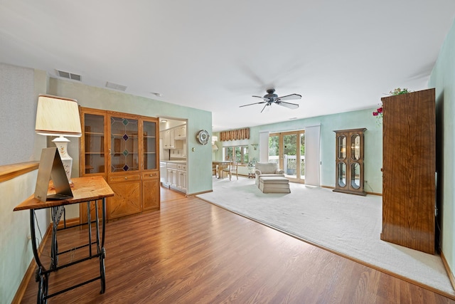 8964 Dublin St Unit 12C, Orland Park, IL 60462 - living room featuring wood finished floors, a ceiling fan, and baseboards