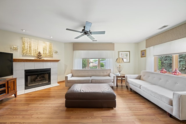 8964 Dublin St Unit 12C, Orland Park, IL 60462 - living room with wood finished floors, a ceiling fan, a fireplace, and recessed lighting