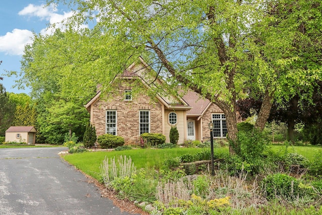 N61W14730 Woodcrest Ct, Menomonee Falls, WI 53051 - view of front of house with brick siding