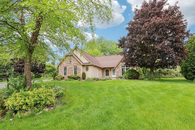 N61W14730 Woodcrest Ct, Menomonee Falls, WI 53051 - view of front of property with a front yard and stone siding