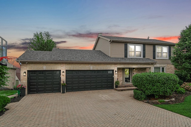 12533 Rosewood Dr, Homer Glen, IL 60491 - view of front of property with decorative driveway, a garage, brick siding, and roof with shingles