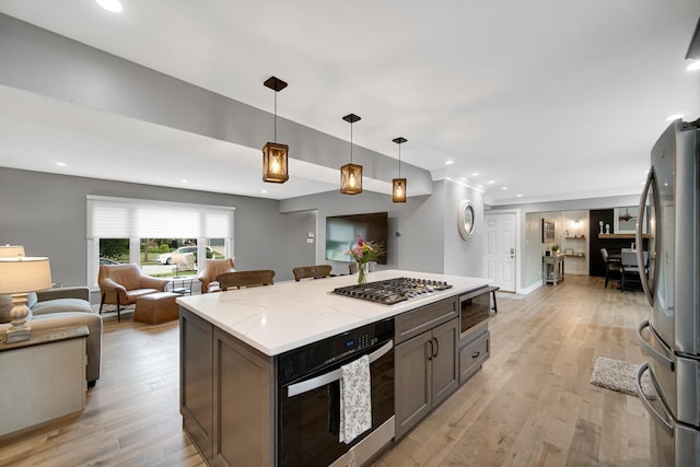 12533 Rosewood Dr, Homer Glen, IL 60491 - kitchen featuring appliances with stainless steel finishes, open floor plan, light wood-type flooring, pendant lighting, and recessed lighting