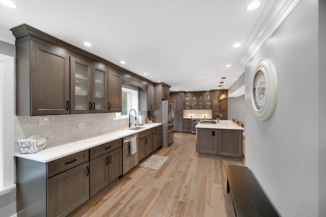 12533 Rosewood Dr, Homer Glen, IL 60491 - kitchen with stainless steel appliances, ornamental molding, dark brown cabinets, light countertops, and recessed lighting